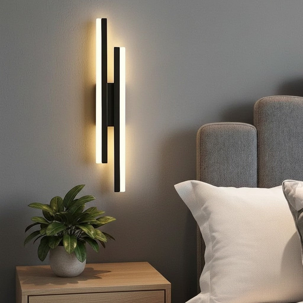 GoldenWatt dimmable black LED wall sconce with acrylic strip light mounted above a wooden bedside table in a bedroom