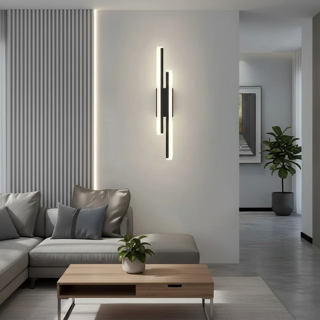 GoldenWatt dimmable black LED wall sconce with acrylic strips mounted in a modern living room with grey sofa.
