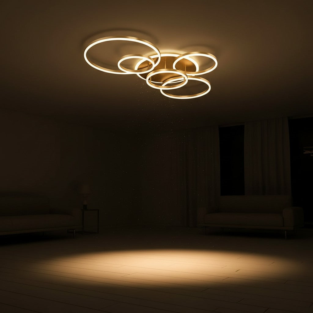 GoldenWatt modern dimmable LED ceiling chandelier with multiple glowing rings in a warm lit living room setting.