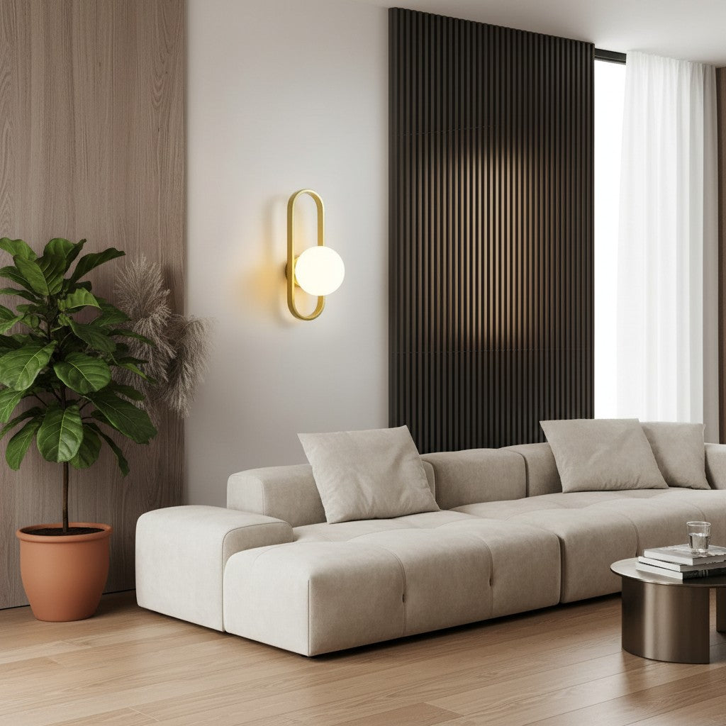GoldenWatt luxury LED wall sconce with a gold oval frame and frosted glass globe shade in a modern living room