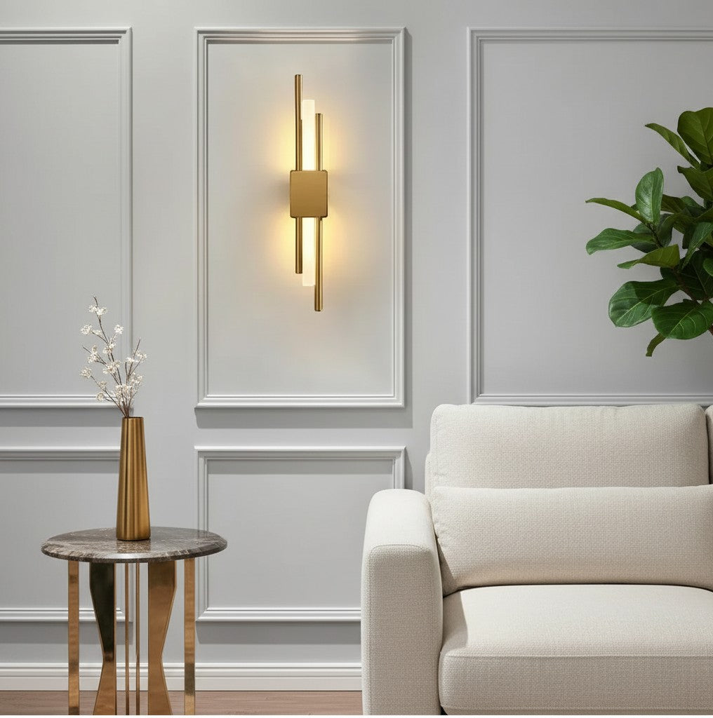 GoldenWatt Nordic contemporary gold LED wall sconce with acrylic accents mounted on a grey paneled wall in a living room