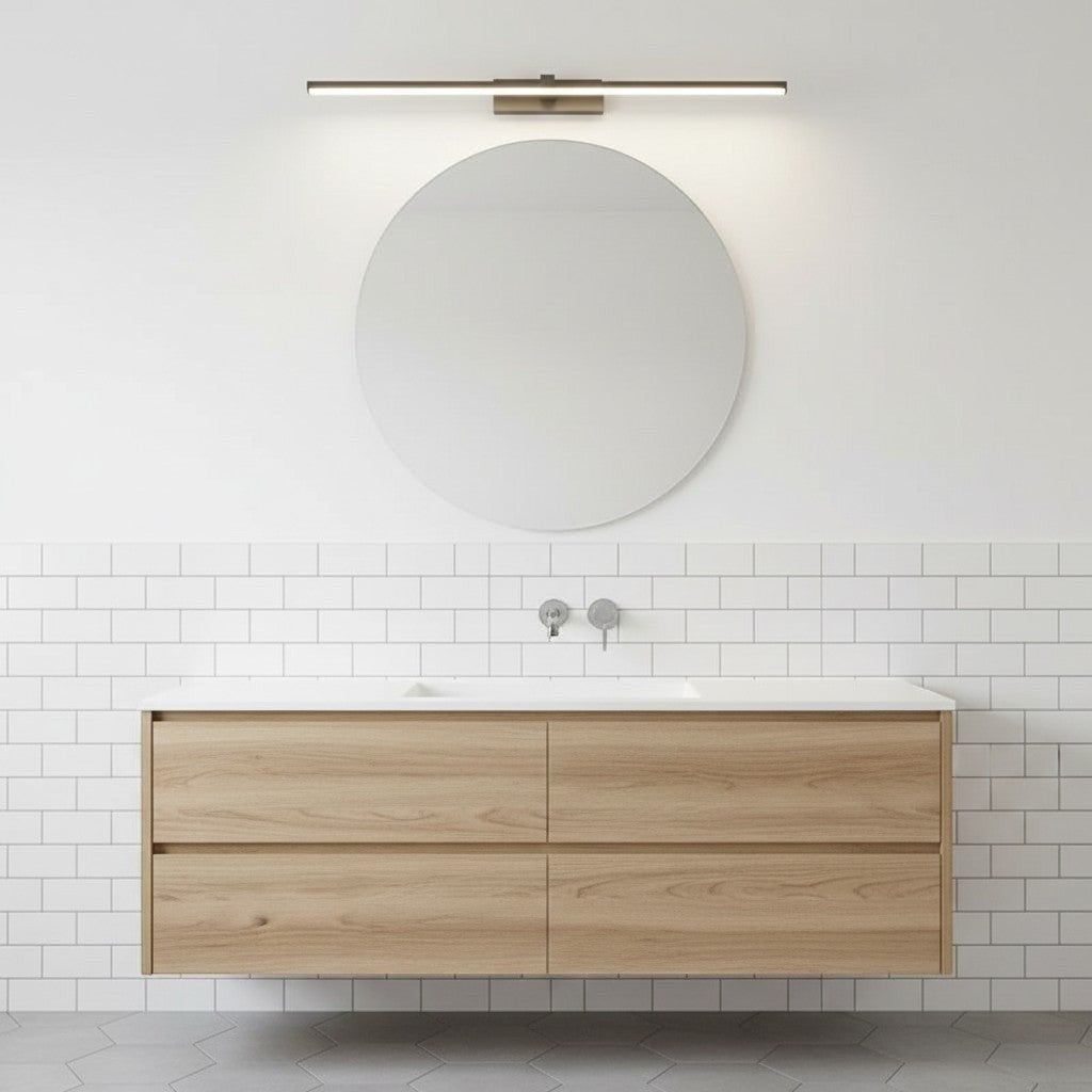 GoldenWatt modern LED vanity wall light mounted above a round mirror in a minimalist bathroom with white subway tiles