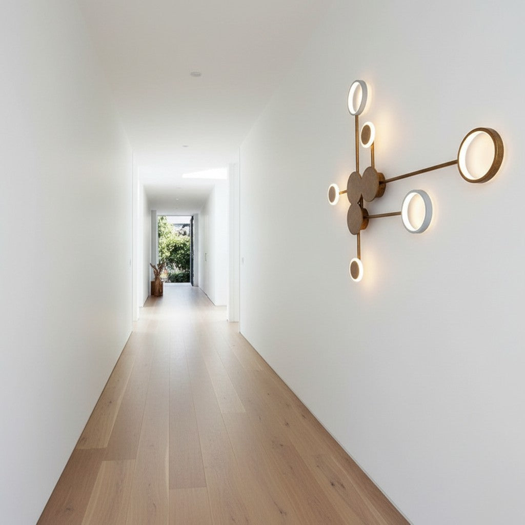 GoldenWatt modern minimalist wall lamp with circular LED heads mounted in a bright white hallway