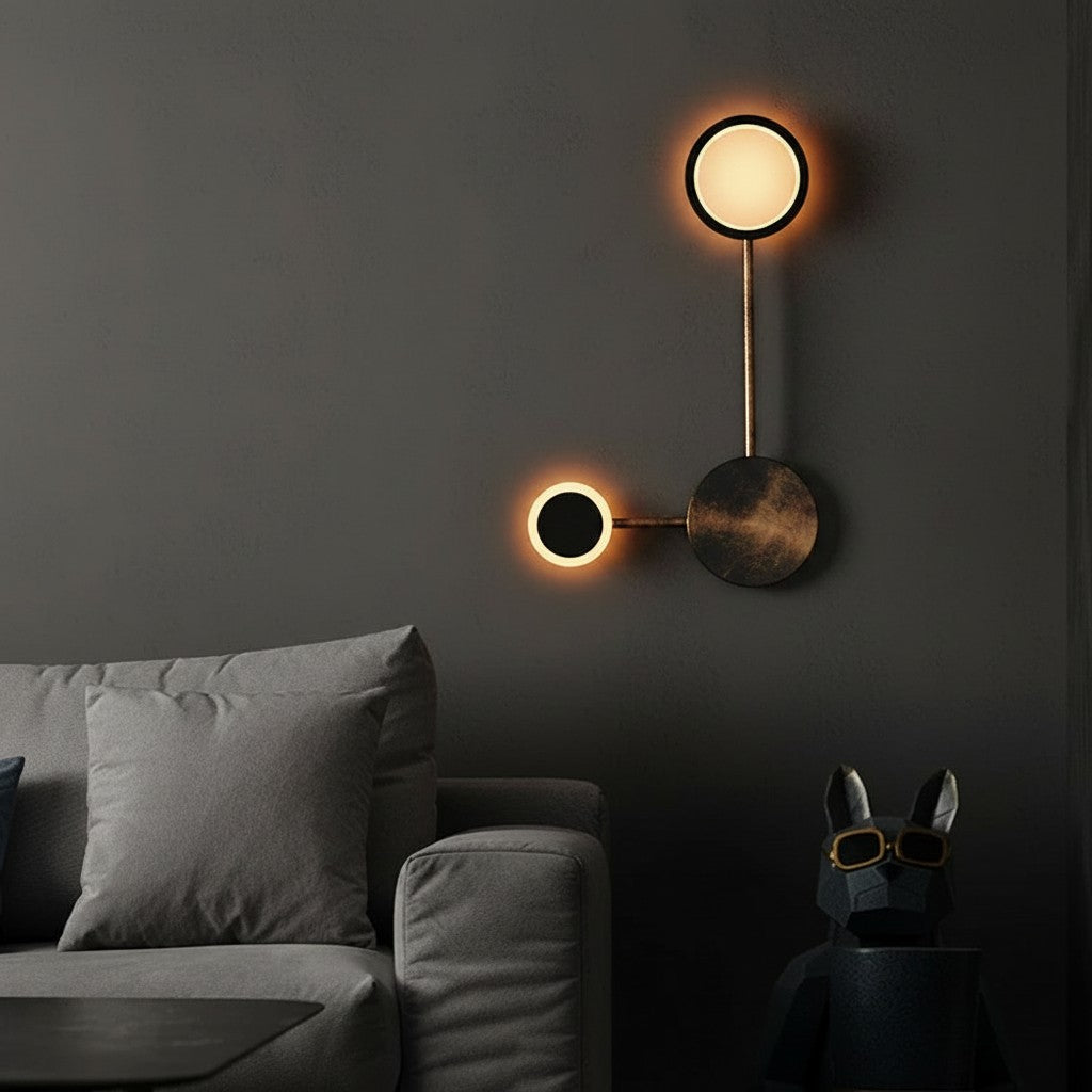 GoldenWatt Nordic minimalist wall lamp with two circular LED heads in a dark modern living room setting