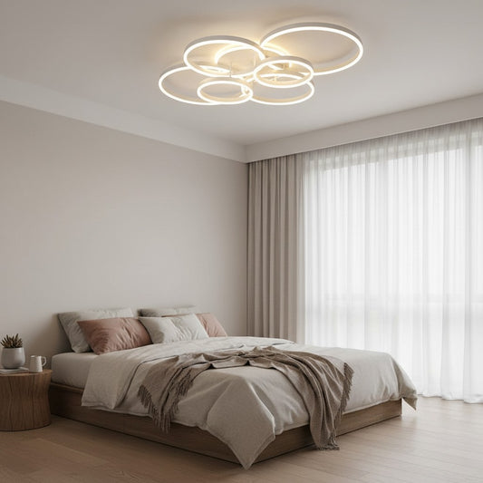 GoldenWatt modern dimmable LED ceiling chandelier with circular rings installed in a minimalist bedroom