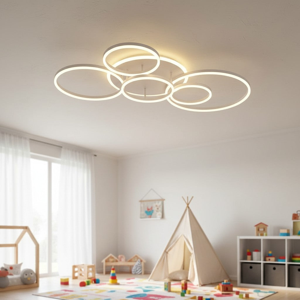 GoldenWatt modern white LED ceiling chandelier with circular ring design, installed in a bright, playful children's room.