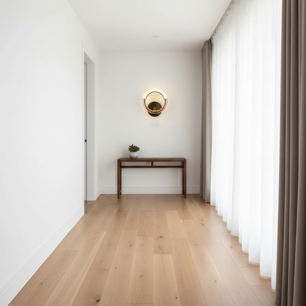 GoldenWatt Nordic gold LED wall sconce with circular design mounted in a minimalist hallway above a wooden console
