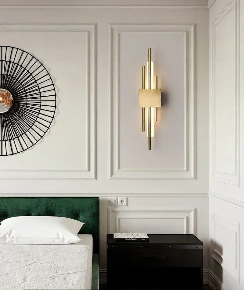 GoldenWatt Nordic contemporary gold LED wall sconce mounted in a modern bedroom with elegant wall molding