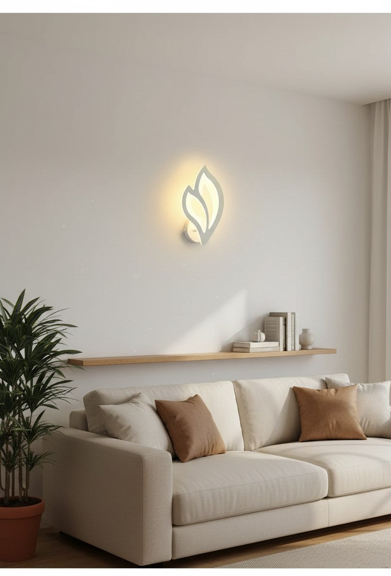 GoldenWatt modern white LED wall sconce with leaf-shaped acrylic shade mounted above a sofa in a living room