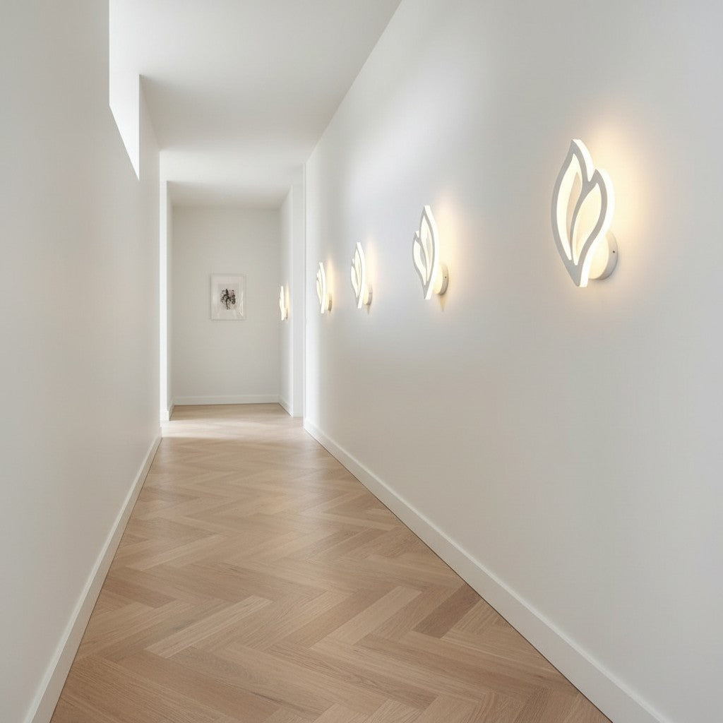 GoldenWatt modern white LED wall sconces with leaf-shaped acrylic shades illuminating a bright minimalist hallway